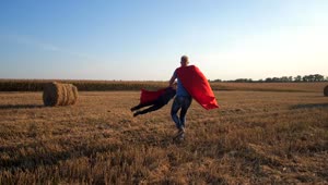 Free Video Stock superheros playing in a field Live Wallpaper