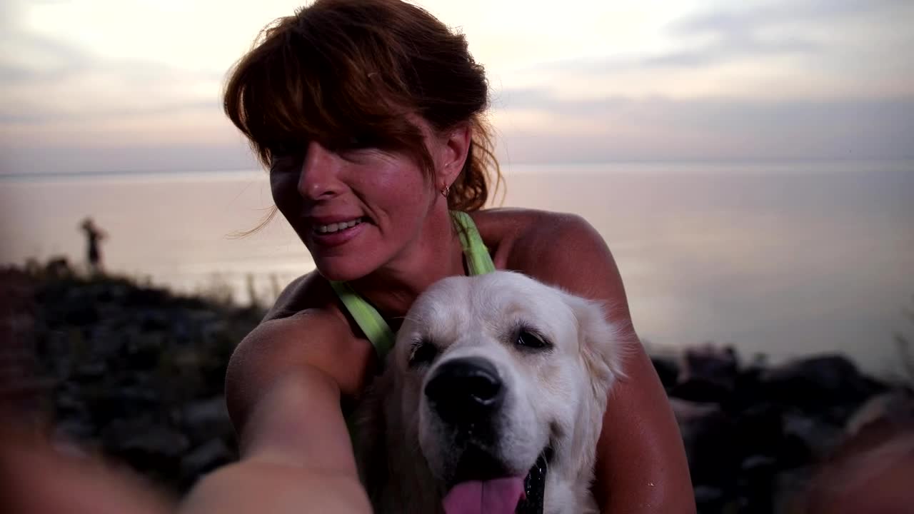 Download Free Video Stock taking a photo with her dog Live Wallpaper