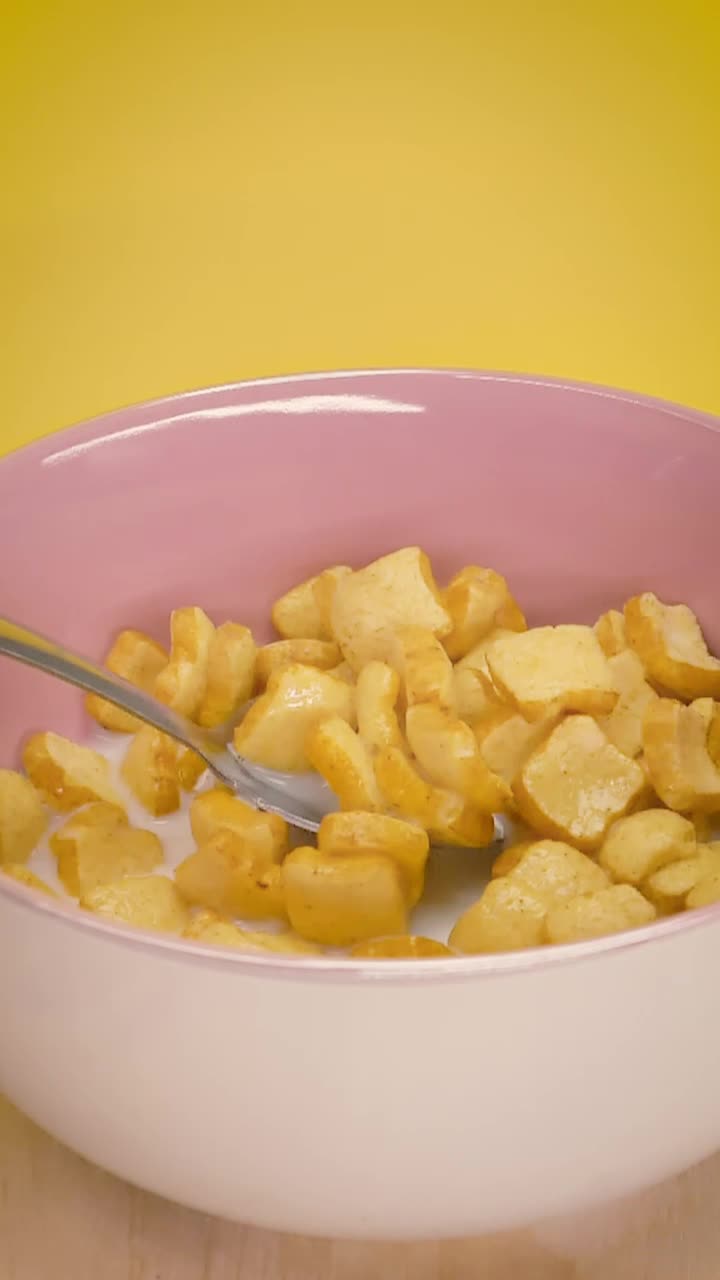 Download Free Video Stock taking cereal with milk from a bowl with a spoon Live Wallpaper