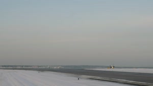 Free Video Stock taking off from a snowy airfield Live Wallpaper