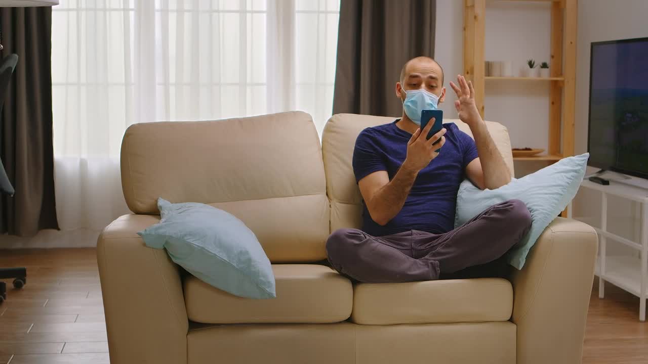 Download Free Video Stock talking on the phone while wearing a mask Live Wallpaper