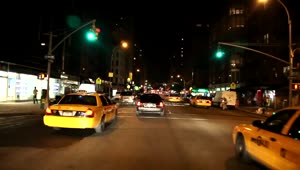 Free Video Stock taxis driving through the streets at night Live Wallpaper