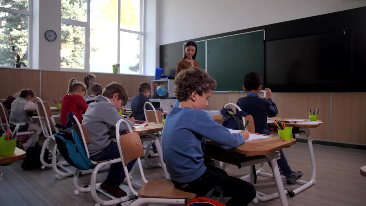 Download Free Video Stock teacher looking at a drawing Live Wallpaper