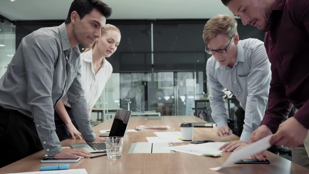 Download Free Video Stock team standing around a table Live Wallpaper