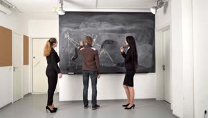 Free Video Stock team working on a blackboard Live Wallpaper
