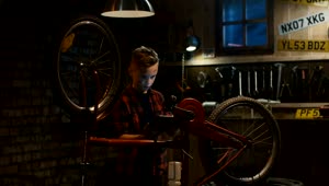 Free Video Stock teen boy watching tutorial to repair the bicycle Live Wallpaper