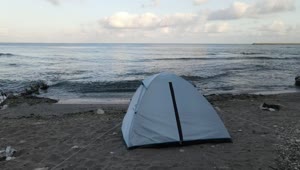 Free Video Stock tent at the edge of the sea on a beach Live Wallpaper