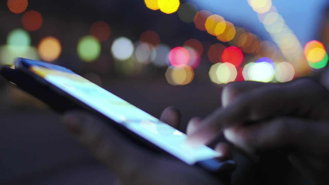 Download Free Video Stock texting in the city at night Live Wallpaper