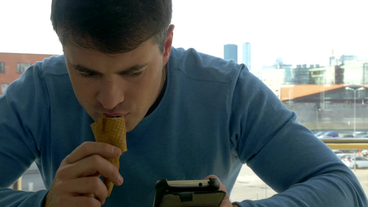 Download Free Video Stock texting while eating an ice cream Live Wallpaper