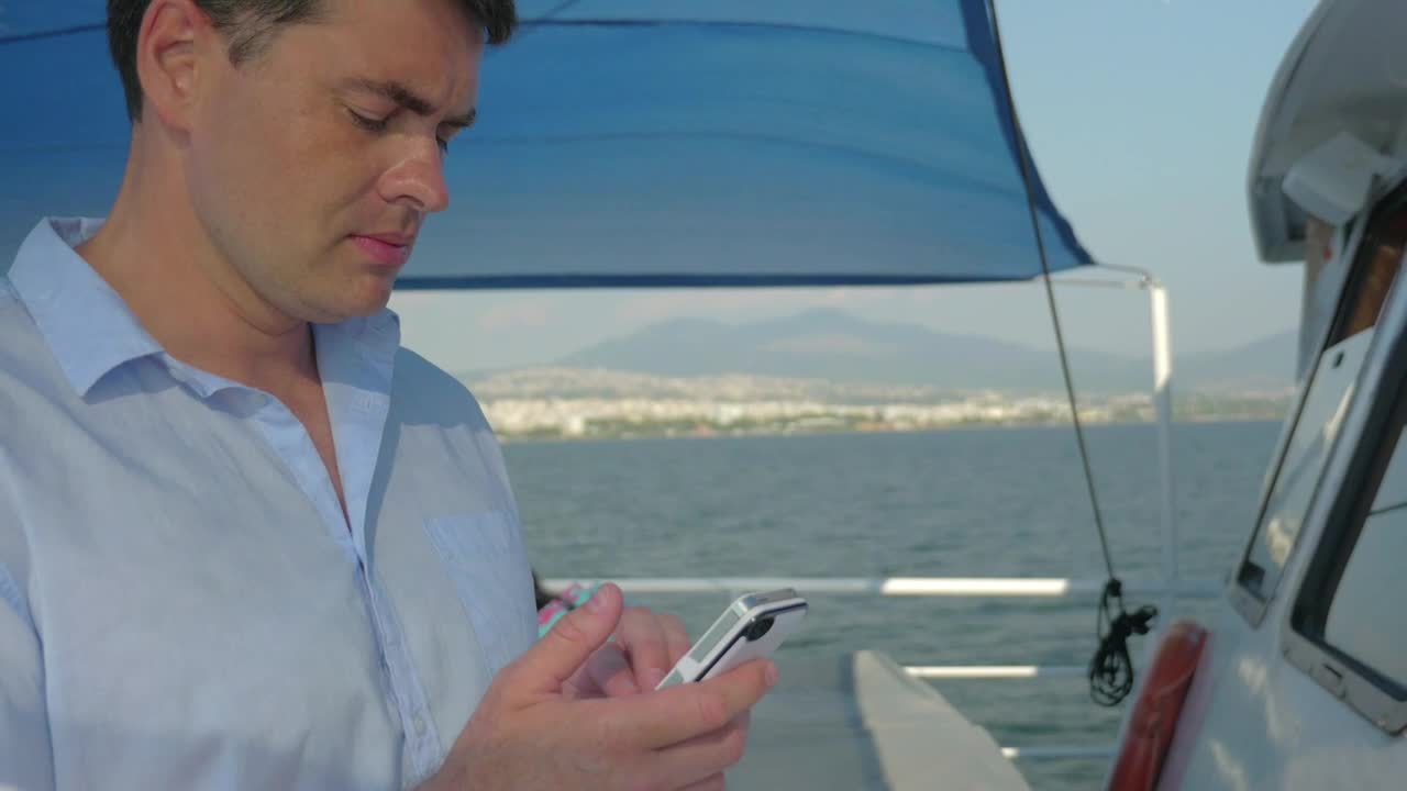 Download Free Video Stock texting while out on a boat Live Wallpaper