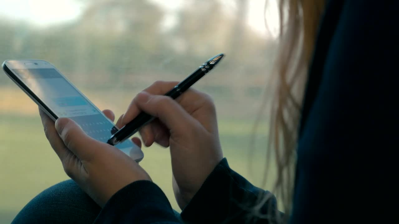 Download Free Video Stock texting while riding a train Live Wallpaper