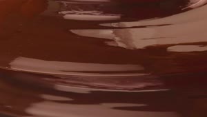 Free Video Stock texture of a liquid chocolate fountain Live Wallpaper