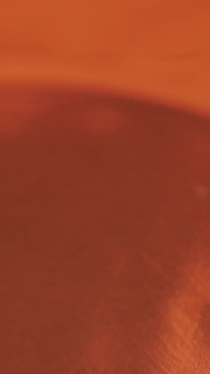 Download Free Video Stock texture of a waving orange liquid Live Wallpaper