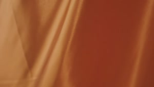 Free Video Stock texture of an orange fabric while waving Live Wallpaper