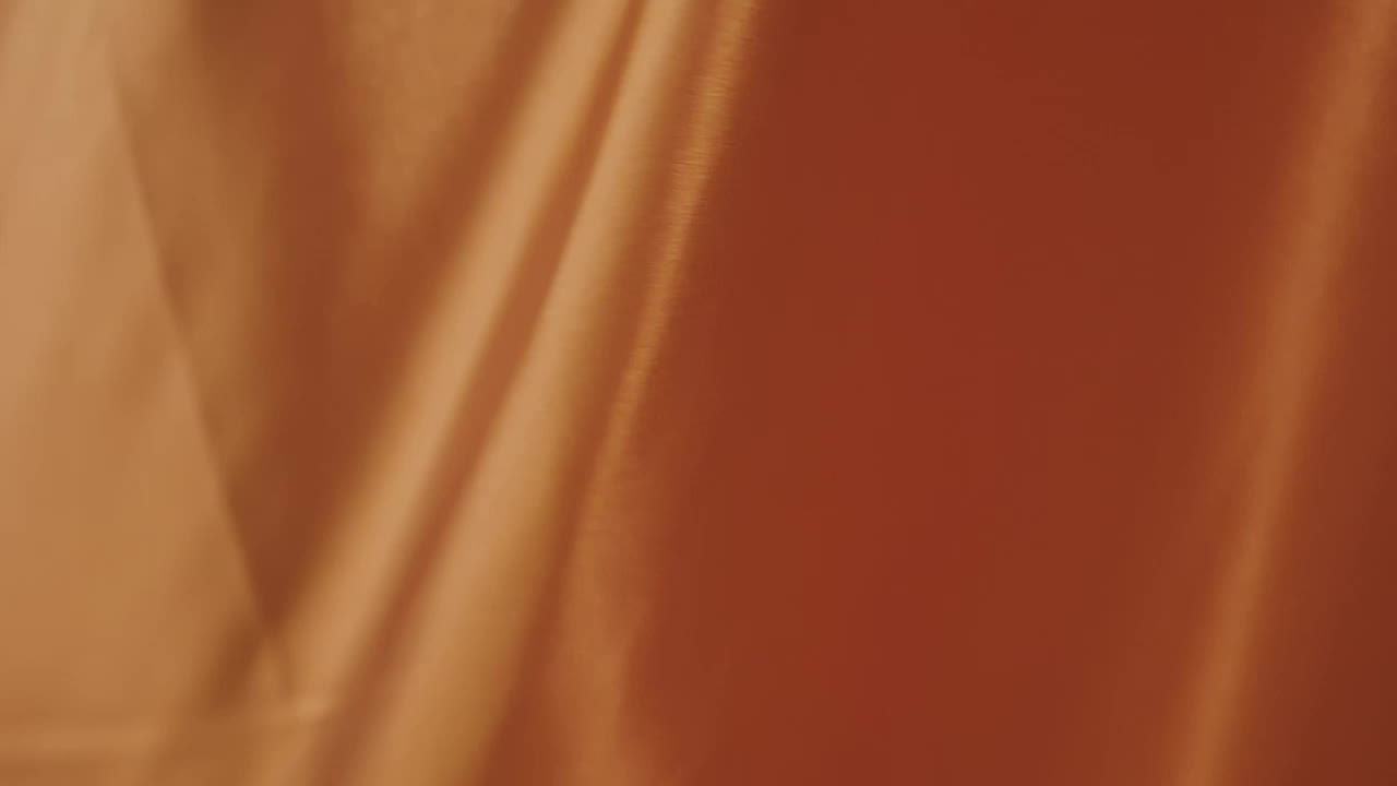 Download Free Video Stock texture of an orange fabric while waving Live Wallpaper