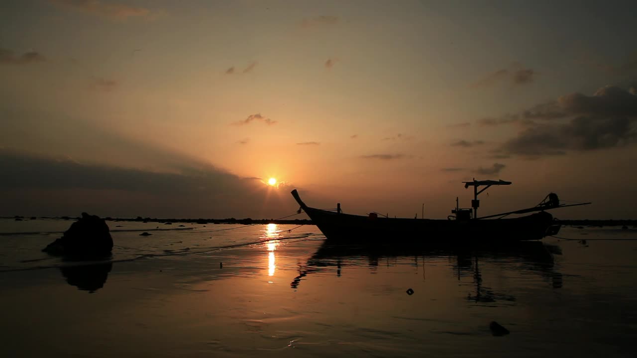 Download Free Video Stock thai boat on the beach during sunset Live Wallpaper