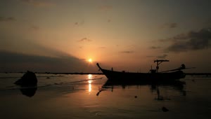 Free Video Stock thai boat on the beach during sunset Live Wallpaper