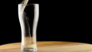 Free Video Stock the beer poured into a glass on a table Live Wallpaper