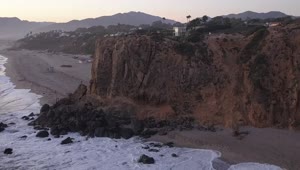 Free Video Stock the flying around a rocky place on a beach Live Wallpaper