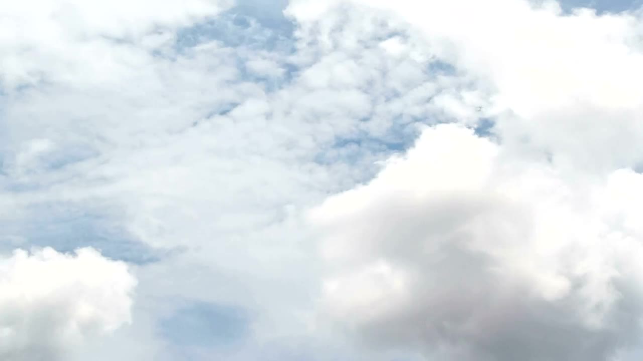 Download Free Video Stock thick white clouds above a city Live Wallpaper