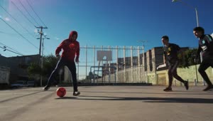 Free Video Stock three men playing soccer in concrete field Live Wallpaper