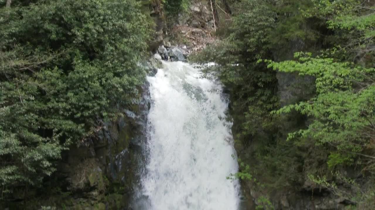 Download Free Video Stock tilt shot of a waterfall in slow motion Live Wallpaper