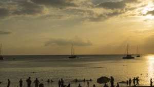 Free Video Stock time lapse of a sunset in a crowded beach Live Wallpaper