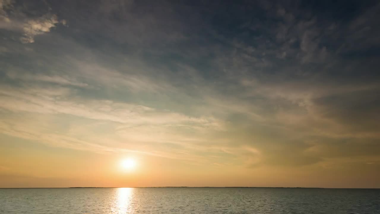 Download Free Video Stock time lapse of the sunrise before a storm at sea Live Wallpaper