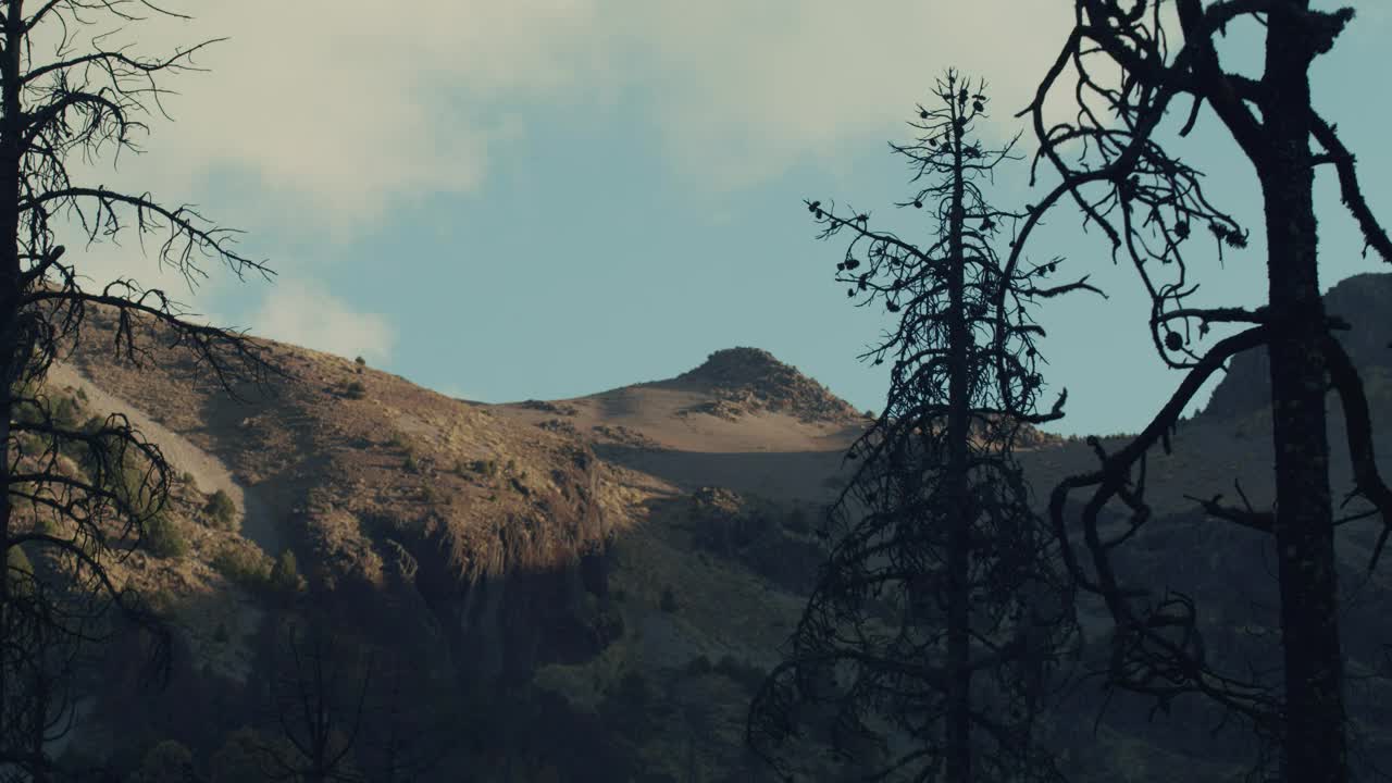 Download Free Video Stock timelapse of the sky behind a mountain Live Wallpaper