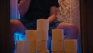 Free Video Stock toilet paper wall and a man sitting in the toilet Live Wallpaper