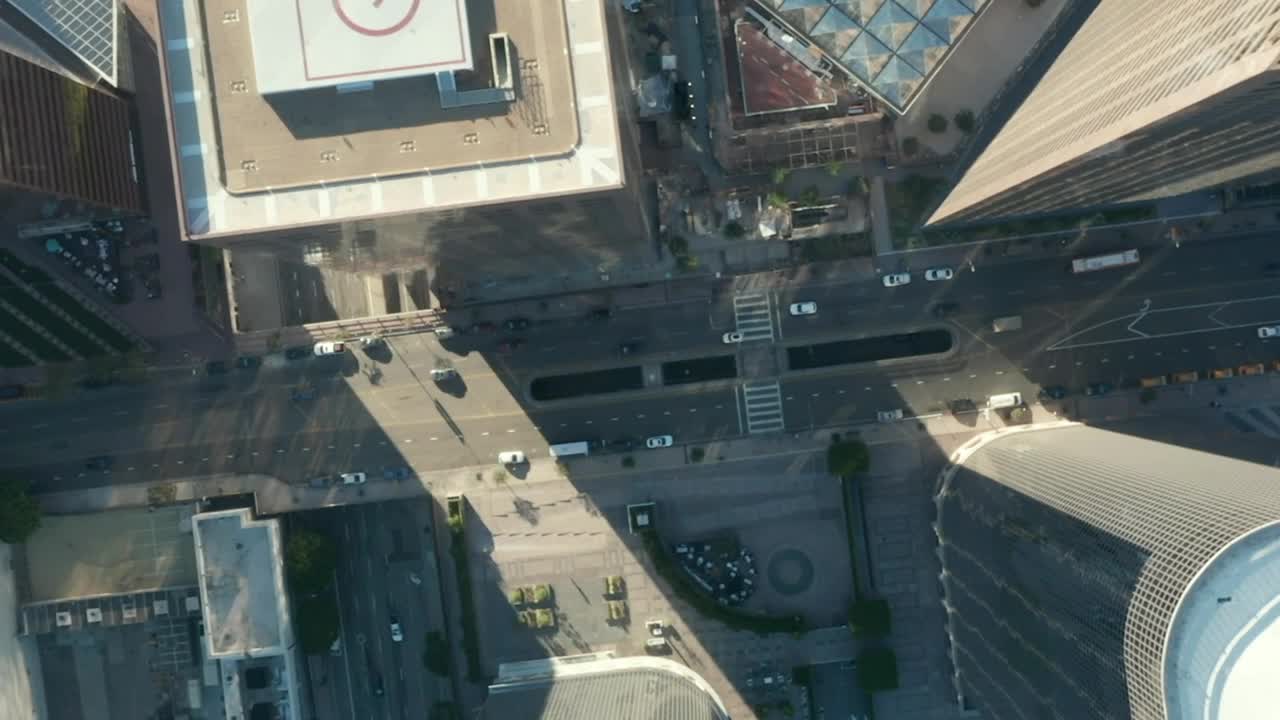 Download Free Video Stock top aerial shot of a city with little traffic Live Wallpaper