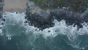 Free Video Stock top aerial shot of seashore with rocks Live Wallpaper