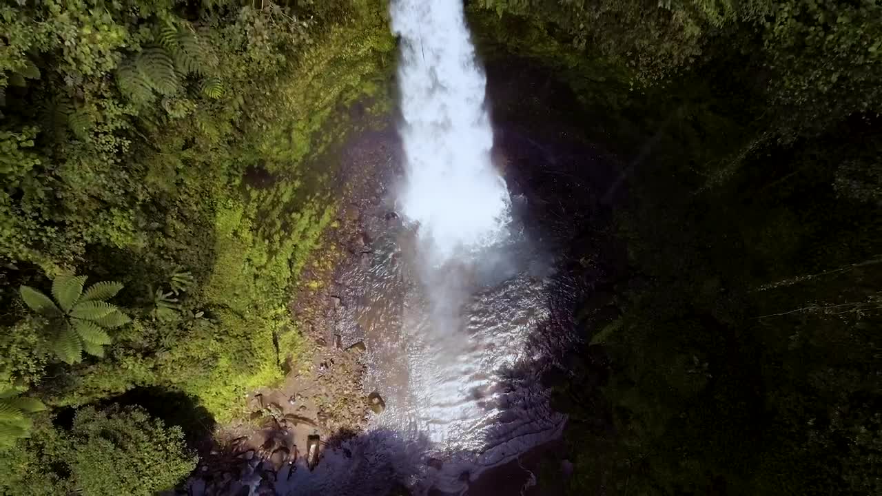 Download Free Video Stock top afar shot of a waterfall in the forest Live Wallpaper