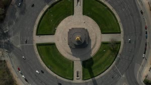 Free Video Stock top shot of a statue roundabout in the city Live Wallpaper