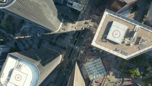 Free Video Stock top spinning aerial shot of a city buildings Live Wallpaper