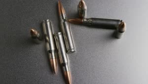 Free Video Stock top view of gun ammunition spinning Live Wallpaper