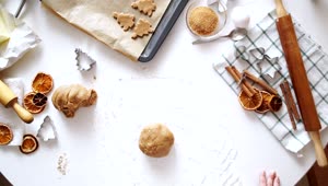 Free Video Stock top view of rolling cookie dough cinnamon and baking tools Live Wallpaper