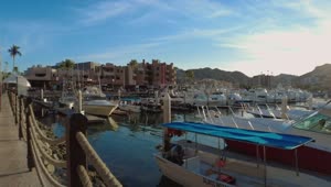 Free Video Stock touring a touristy and sunny port with boats and sailboats Live Wallpaper