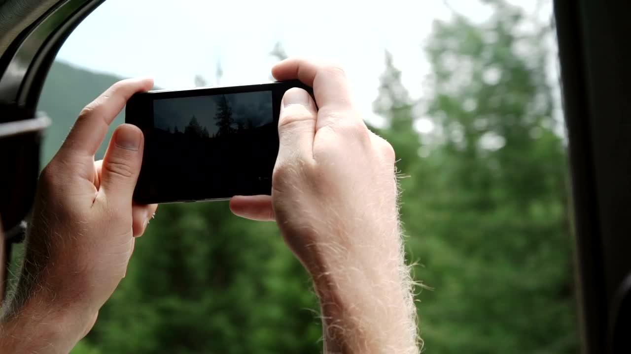 Download Free Video Stock tourist taking photos from a train with his mobil Live Wallpaper