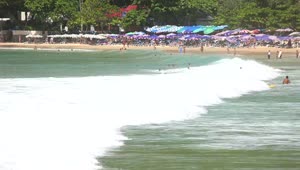 Free Video Stock tourists enjoying the tropical beach Live Wallpaper