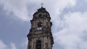 Free Video Stock tower of a church with a clock on a sunny Live Wallpaper