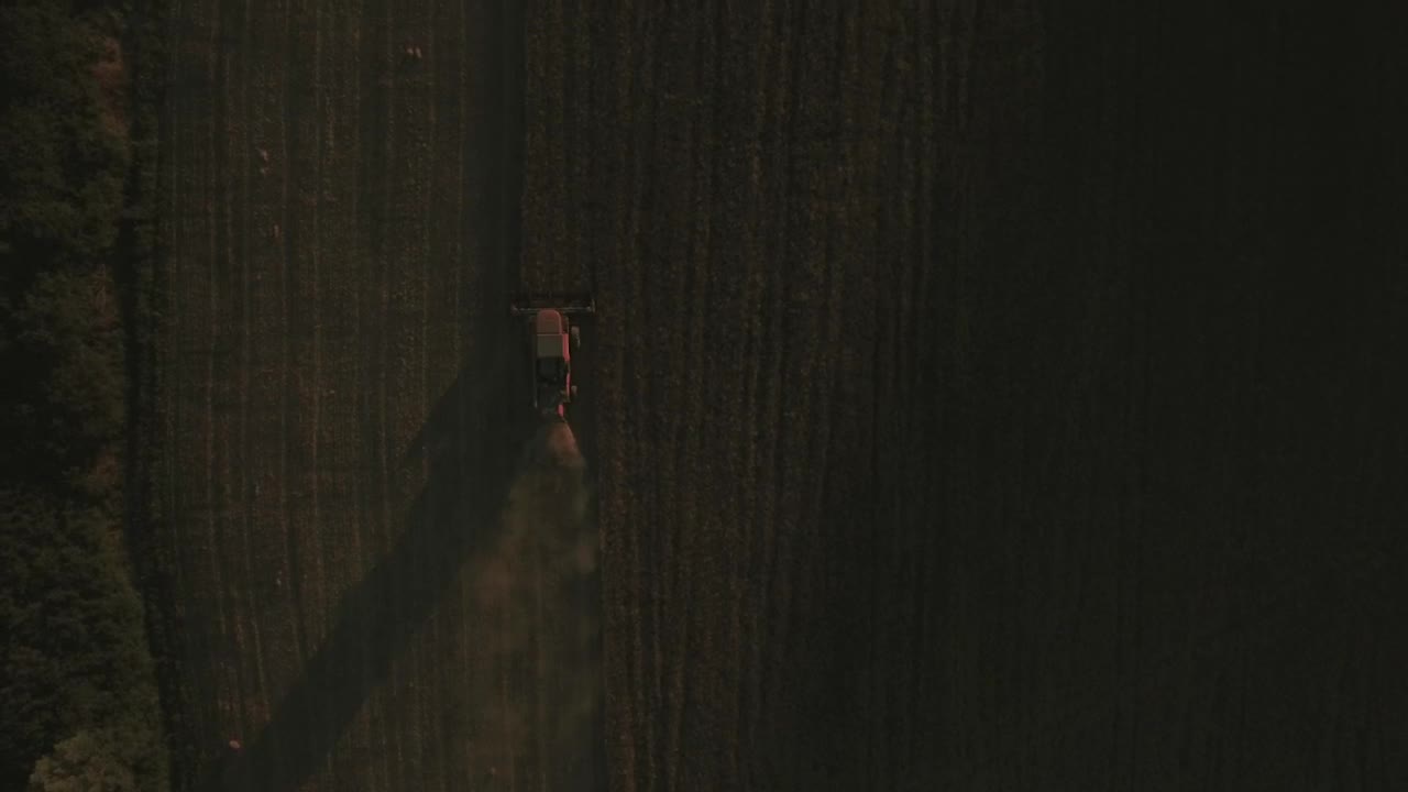 Download Free Video Stock tractor driving over a field Live Wallpaper