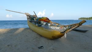 Free Video Stock traditional yellow fishing boat at the beach Live Wallpaper