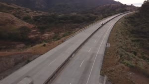 Free Video Stock traffic on the highway between the hills Live Wallpaper