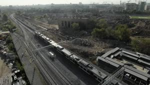Free Video Stock train heading away from an industrial city Live Wallpaper