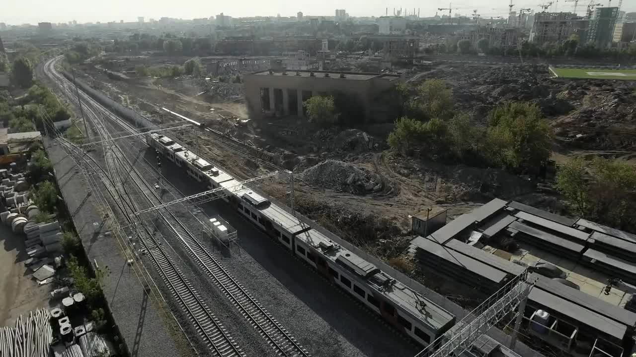 Download Free Video Stock train heading away from an industrial city Live Wallpaper