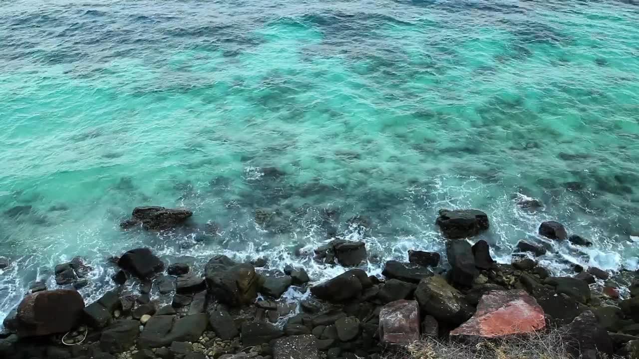 Download Free Stock Video Waves Breaking Over Dark Rocks Live Wallpaper