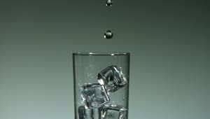Free Stock Video Water Drops Falling Into A Glass With Ice Cubes Live Wallpaper