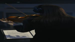 Free Stock Video Violinist Playing A Sheet Music In A Recording Studio Live Wallpaper