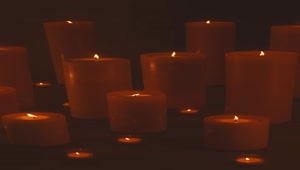 Free Stock Video Very Large And Very Small Candles Lit In The Dark Smalllive Wallpaper